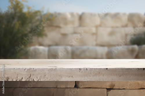 closeup of a table made of limestone  and limestone wall in the background  