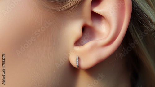 Close-up of ear for earring advertisement photo