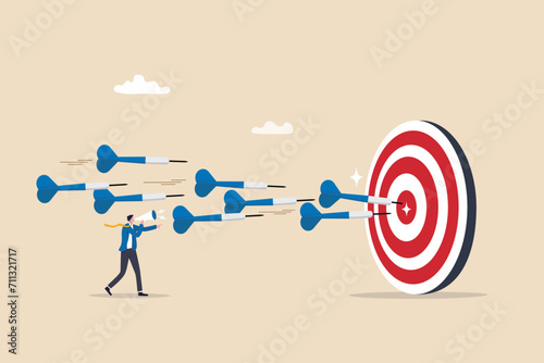 Marketing target strategy, leadership or skill to reach target or achievement, aiming for perfection winning, challenge or accuracy concept, businessman control dart to reach perfect target bullseye. photo