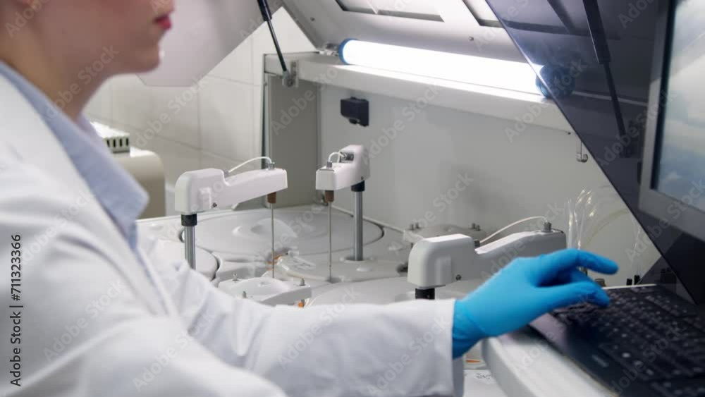 A medical research laboratory with a diverse team of biochemical scientists working with computers and modern medical technologies. Development of high-tech equipment for medicines. A medical research laboratory with a diverse team of biochemical scientists working with computers and modern medical technologies. Development of high-tech equipment for medicines.