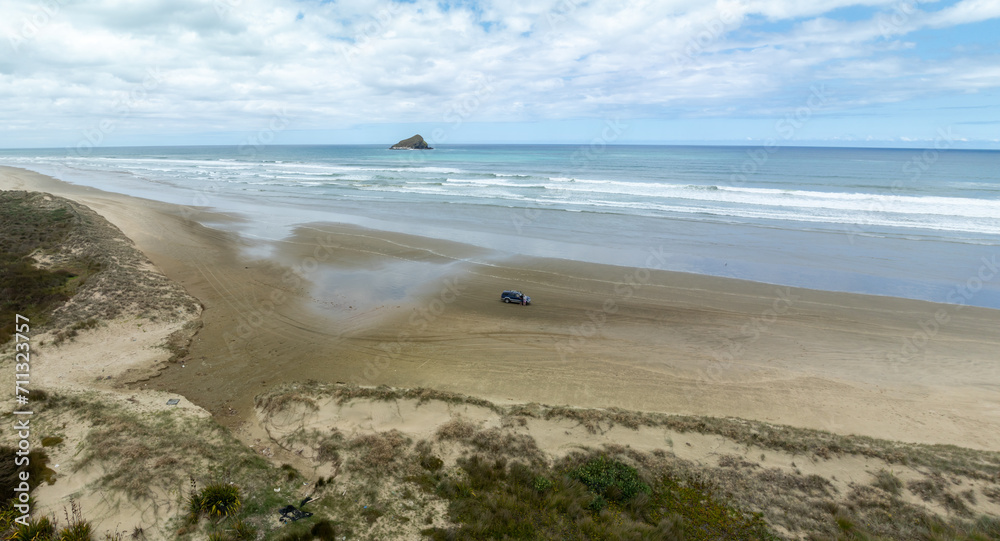 Sport Utility vehicle on 90 Mile Beach, Northland, New Zealand.