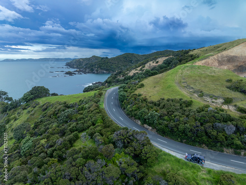 Aerial of road going along the coastline of Elliot Bay, Northland, New Zealand.
