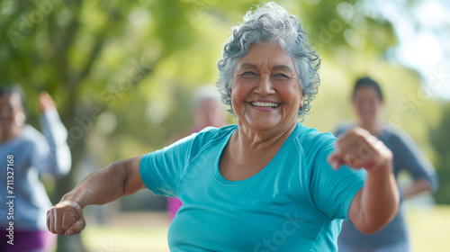Happy elderly woman enjoys outdoor aerobic exercising at park. Senior people with outdoor activity and hobby after retirement.
