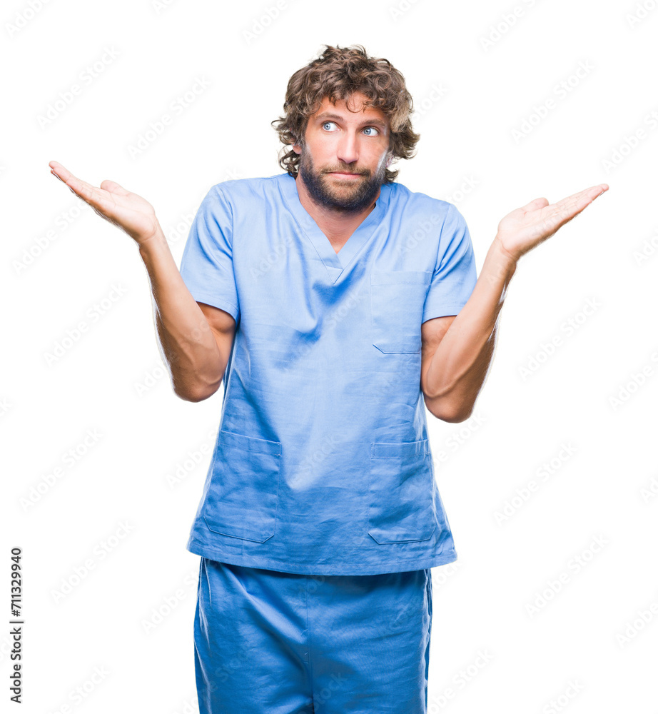 Handsome hispanic surgeon doctor man over isolated background clueless and confused expression with arms and hands raised. Doubt concept. Handsome hispanic surgeon doctor man over isolated background clueless and confused expression with arms and hands raised. Doubt concept.