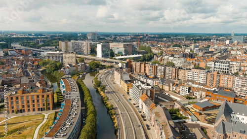 Ghent, Belgium. Esco (Scheldt) river embankment. Panorama of the city from the air. Cloudy weather, summer day, Aerial View