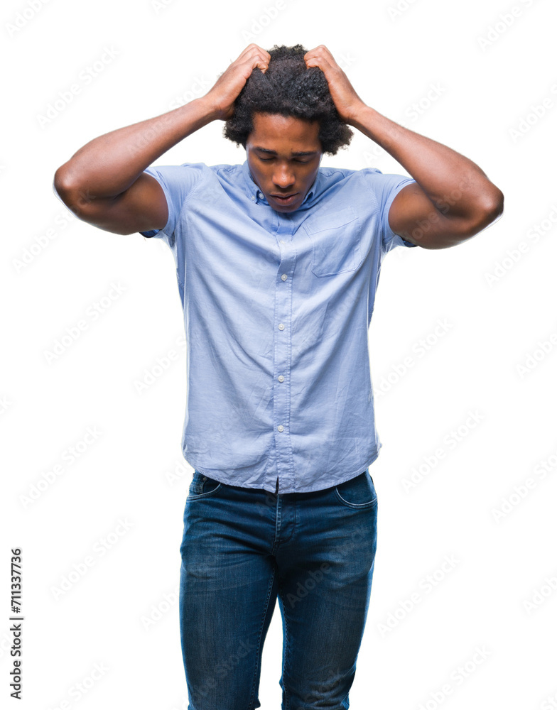 Afro american man over isolated background suffering from headache desperate and stressed because pain and migraine. Hands on head. Afro american man over isolated background suffering from headache desperate and stressed because pain and migraine. Hands on head.