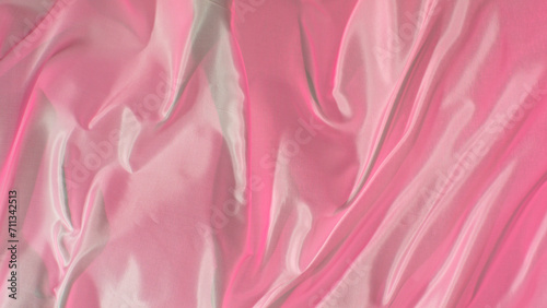 Pastel color transparent silk fabric flowing by wind, close-up