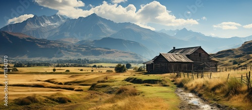 beautiful old wooden house with mountains in the background