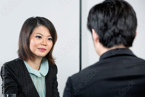 Chinese man being interviewed.