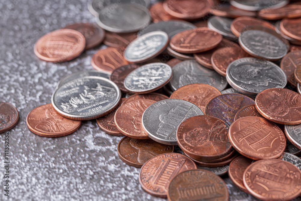 American coins and US dollars on a wooden table American coins and US dollars on a wooden table