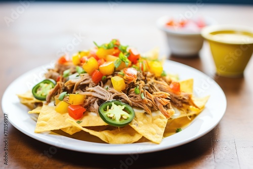 close-up of nachos topped with pulled pork