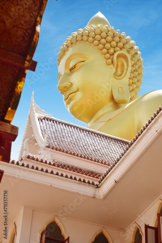 Wat Paknam Temple of Thailand Bangkok Huge Golden Buddha peeks from between the roofs