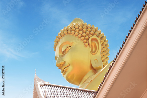 Wat Paknam Temple of Thailand Bangkok Huge Golden Buddha peeks from between the roofs