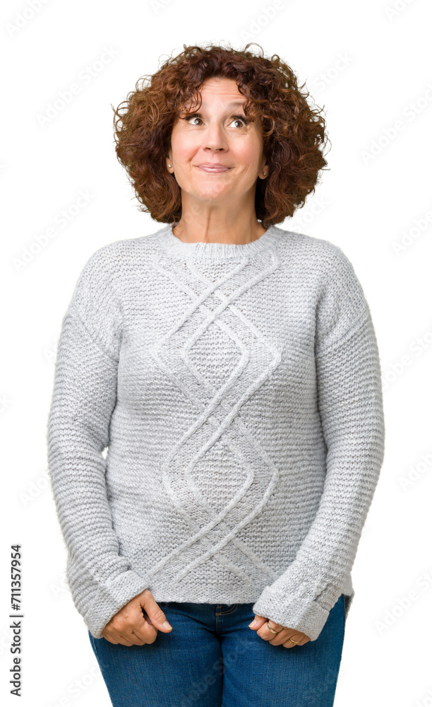 Beautiful middle ager senior woman wearing winter sweater over isolated background smiling looking side and staring away thinking. Beautiful middle ager senior woman wearing winter sweater over isolated background smiling looking side and staring away thinking.