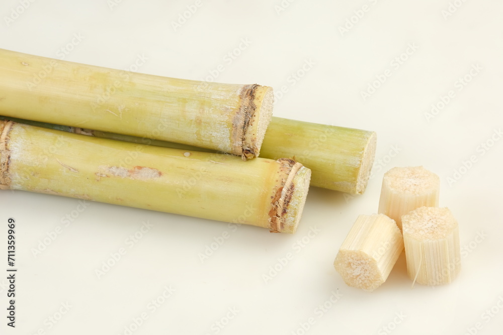 Fresh sugar cane isolated on white background