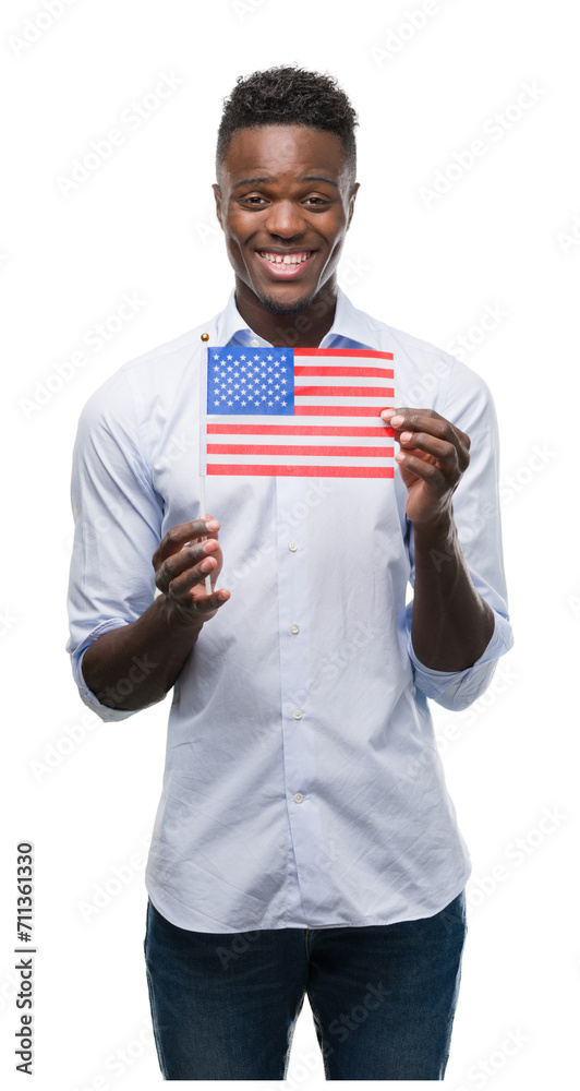 Young african american man holding USA flag with a happy face standing and smiling with a confident smile showing teeth