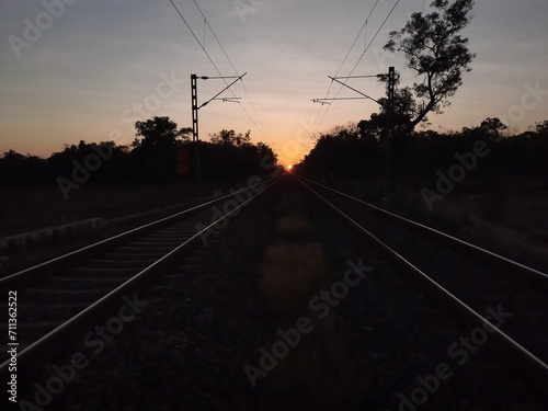 railway in sunset. railway track over sunset.