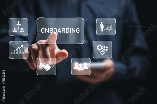 Onboarding business process concept. Businessman touch virtual onboarding icon for making sure new employees can hit the ground running with their new team.