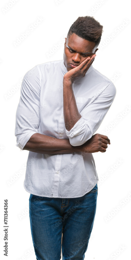 Young african american man over isolated background thinking looking tired and bored with depression problems with crossed arms. Young african american man over isolated background thinking looking tired and bored with depression problems with crossed arms.