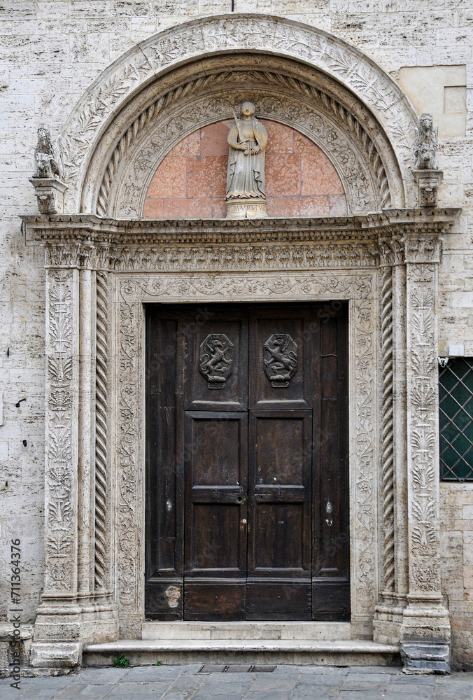 Intricate door of Palazzo del Capitano del Popolo in Perugia, Italy