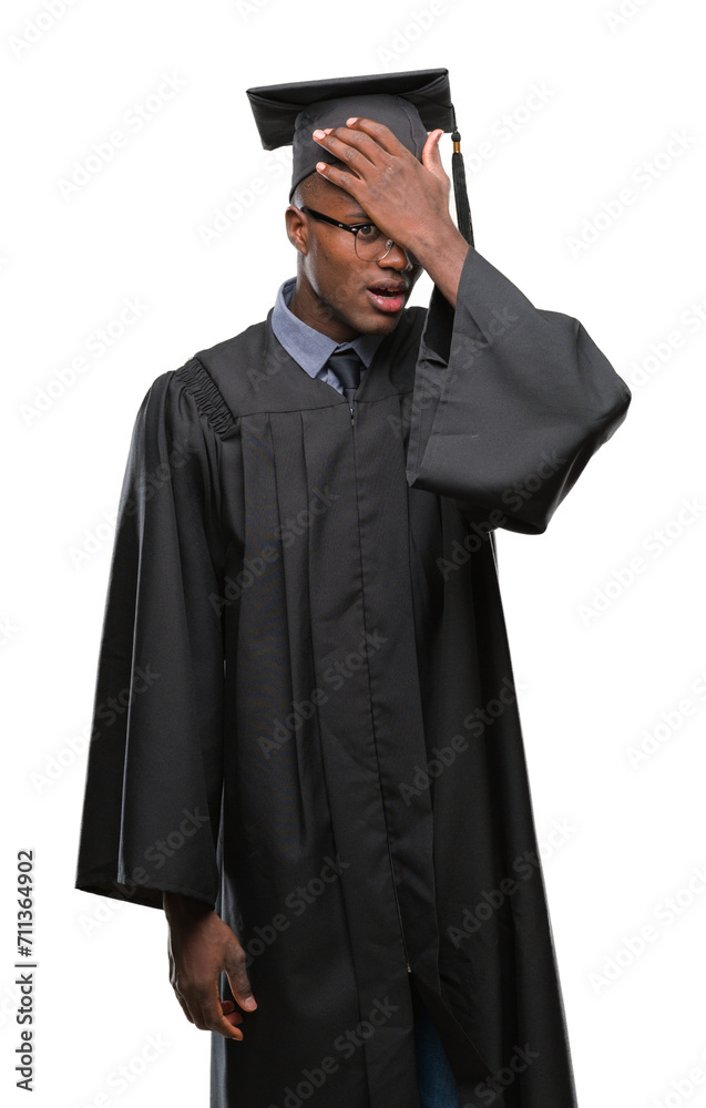 Young graduated african american man over isolated background surprised with hand on head for mistake, remember error. Forgot, bad memory concept. Young graduated african american man over isolated background surprised with hand on head for mistake, remember error. Forgot, bad memory concept.