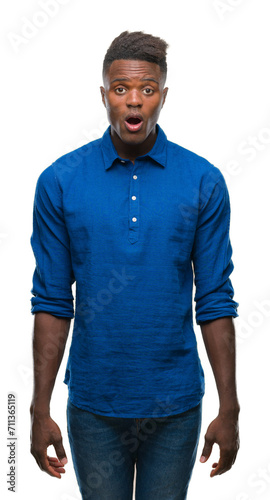 Young african american man over isolated background afraid and shocked with surprise expression, fear and excited face.