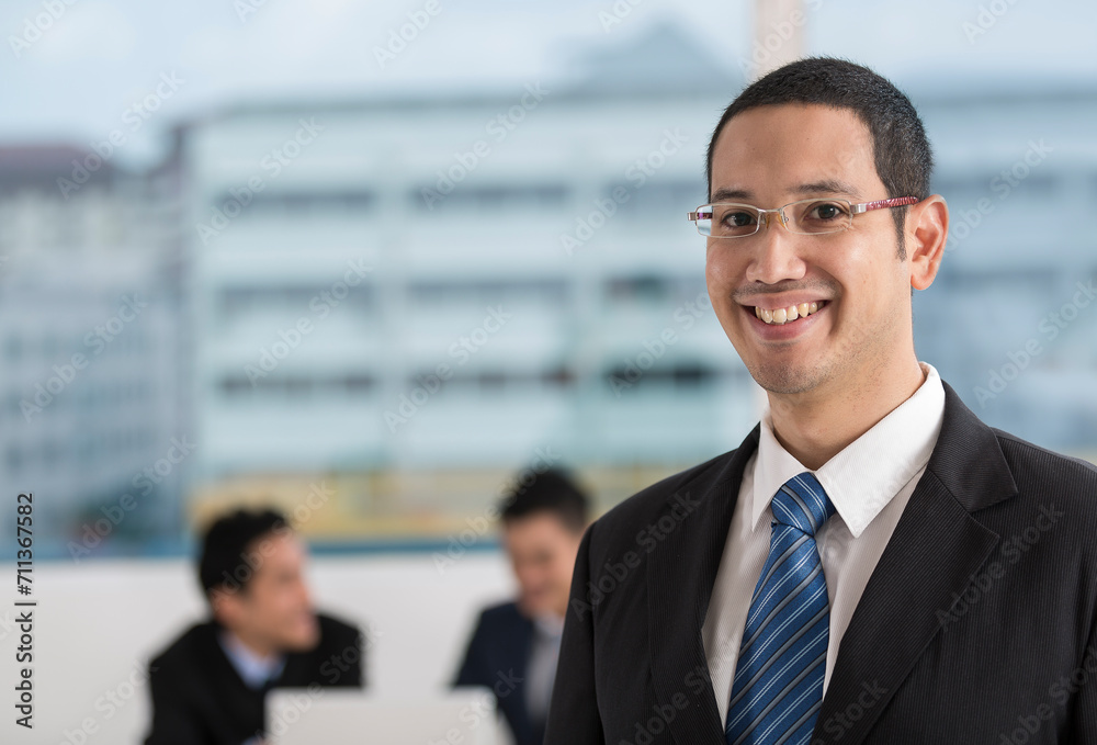 Happy Business man with his multi-ethnic team Happy Business man with his multi-ethnic team