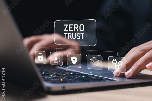 Zero trust security concept, Businessman use laptop with virtual zero trust icon for business information security network. photo