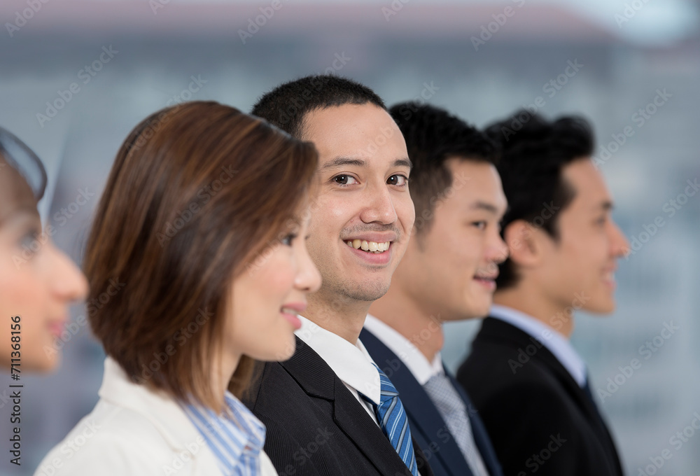 Happy Business man with his multi-ethnic team Happy Business man with his multi-ethnic team