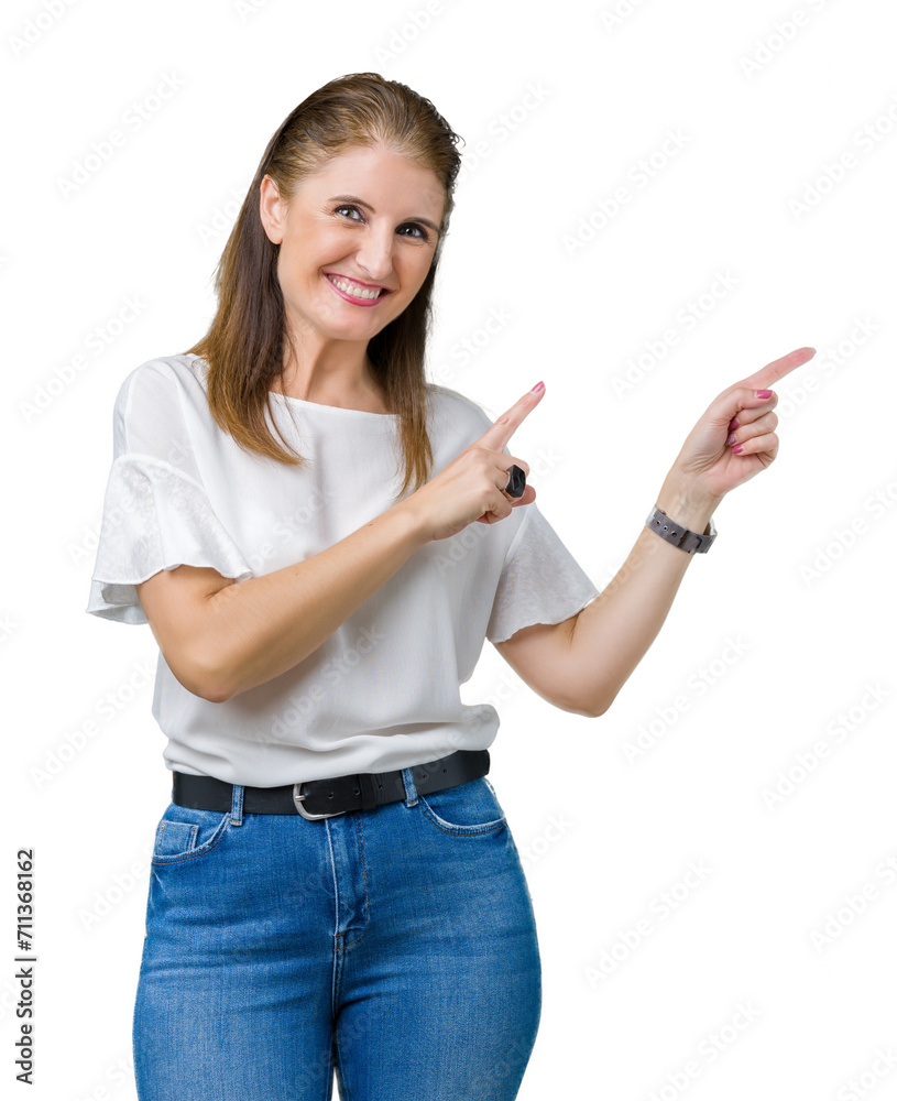 Middle age mature beautiful woman over isolated background smiling and looking at the camera pointing with two hands and fingers to the side. Middle age mature beautiful woman over isolated background smiling and looking at the camera pointing with two hands and fingers to the side.