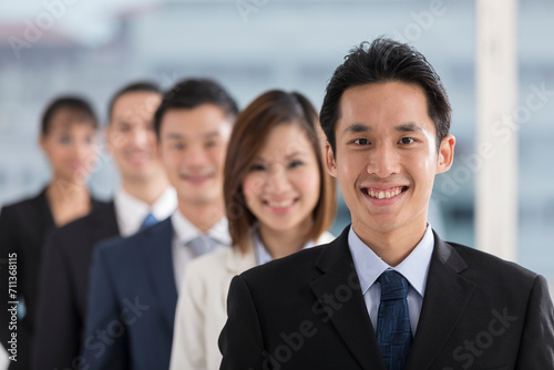 Happy Asian Business man with his team