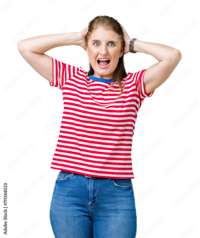 Middle age mature woman wearing casual t-shirt over isolated background Crazy and scared with hands on head, afraid and surprised of shock with open mouth Middle age mature woman wearing casual t-shirt over isolated background Crazy and scared with hands on head, afraid and surprised of shock with open mouth