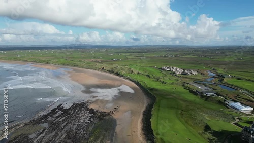 Aerial establishing shot of Trump Doonbeg hotel overlooking Doughmore Bay
