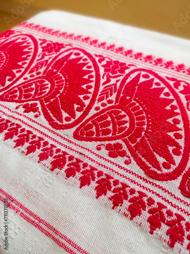 Gamosa or gamusa is a traditional textile pattern from Assam. It is a white piece of cloth with red stripes and red motifs, which is used in Bihu and resembles Ukrainian and Russian patterns.