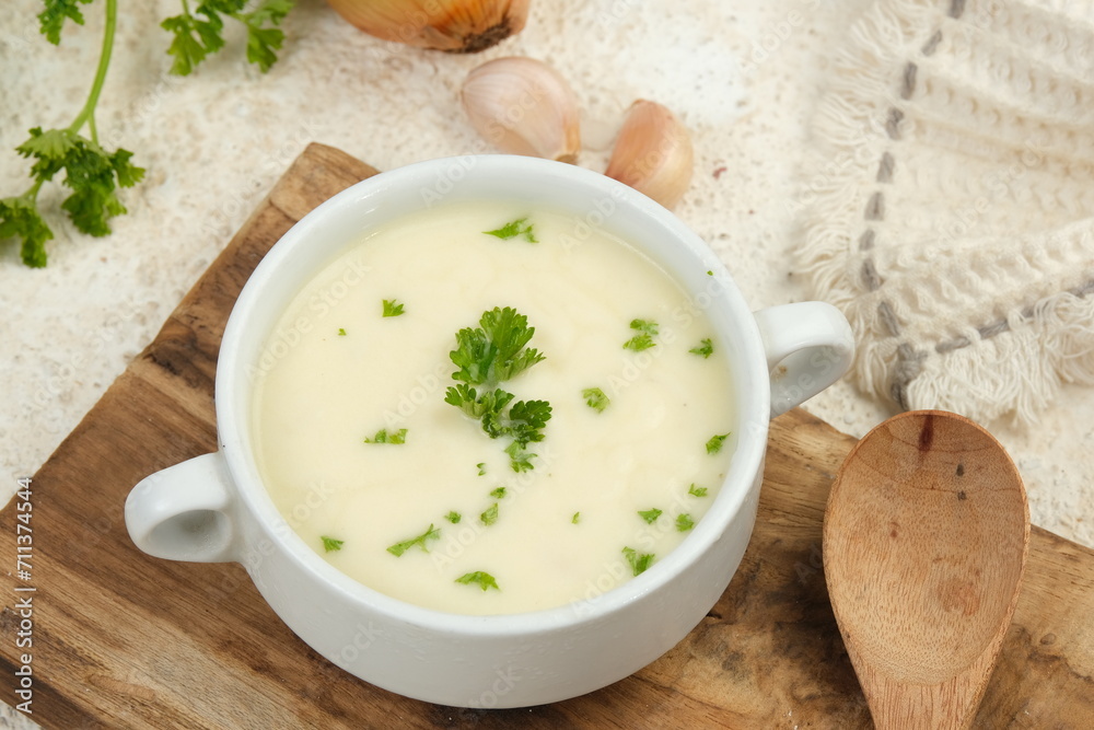 Bowl of cream soup on white table Bowl of cream soup on white table
