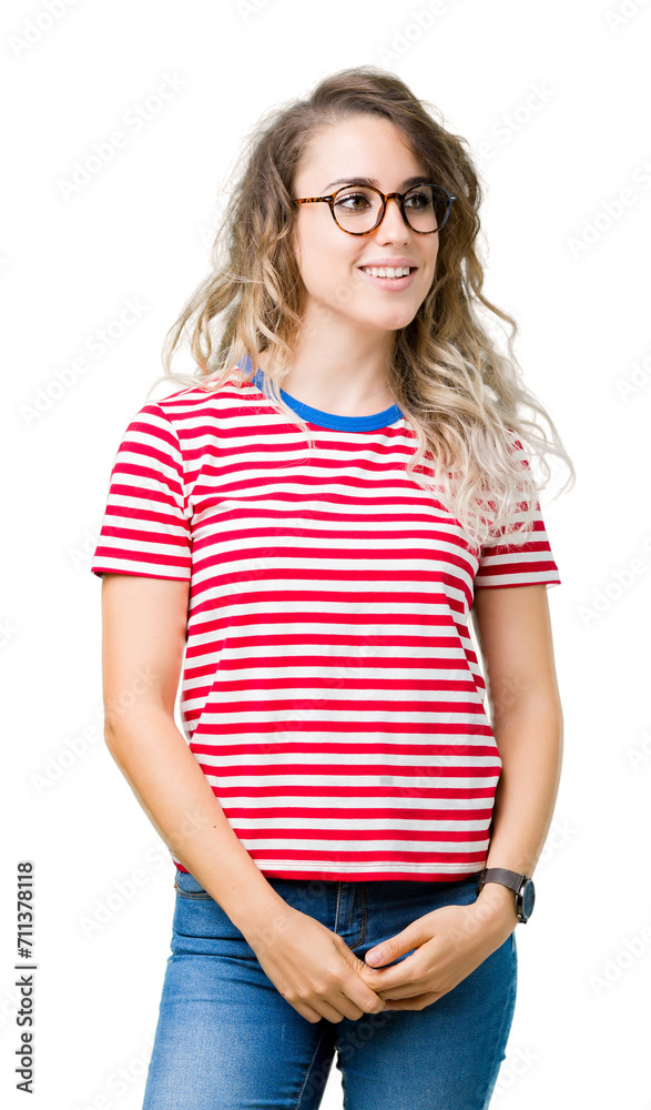 Beautiful young blonde woman wearing glasses over isolated background looking away to side with smile on face, natural expression. Laughing confident. Beautiful young blonde woman wearing glasses over isolated background looking away to side with smile on face, natural expression. Laughing confident.