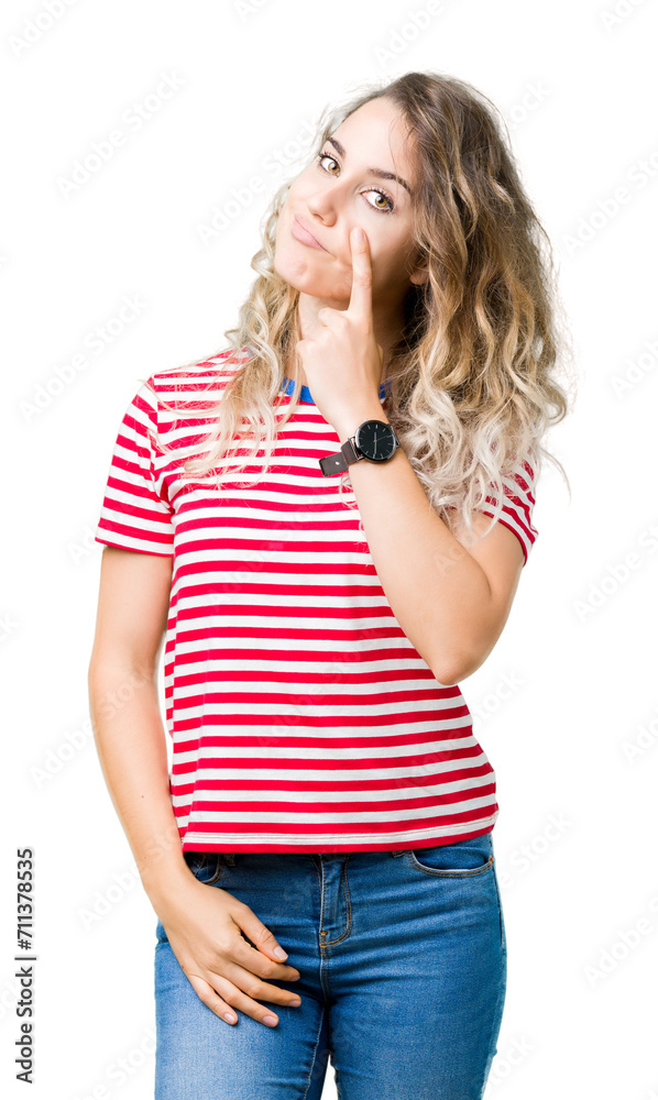 Beautiful young blonde woman over isolated background Pointing to the eye watching you gesture, suspicious expression Beautiful young blonde woman over isolated background Pointing to the eye watching you gesture, suspicious expression