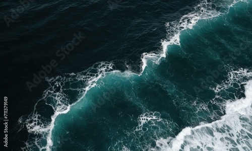 Aerial View of Crashing Waves in Deep Blue Sea