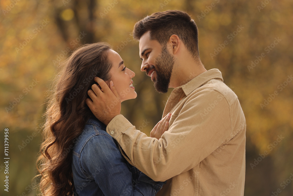 Beautiful couple spending time together in autumn park Beautiful couple spending time together in autumn park