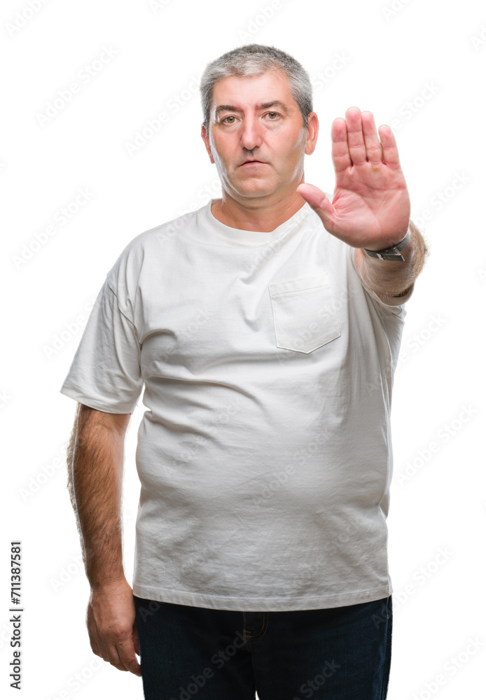 Handsome senior man over isolated background doing stop sing with palm of the hand. Warning expression with negative and serious gesture on the face. Handsome senior man over isolated background doing stop sing with palm of the hand. Warning expression with negative and serious gesture on the face.
