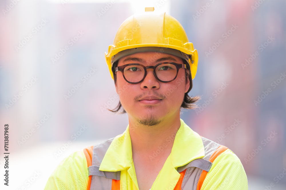 Close up of male container yard worker at commercial dock site. Male container worker at container terminal yard Close up of male container yard worker at commercial dock site. Male container worker at container terminal yard