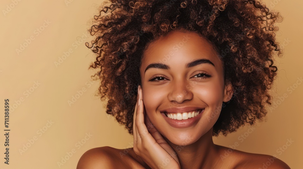 Happy young adult African American woman beauty female model, pretty 20s Black lady with curly hair beautiful face advertising skin care products isolated at beige background. Aesthetic authentic shot - obrazy, fototapety, plakaty 