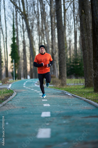 Man running in the park in wintertime