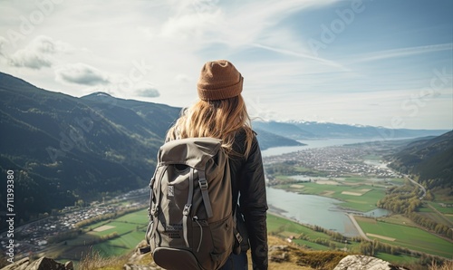 Exploring Nature's Vast Beauty: Adventurous Woman Gazing at Scenic Valley