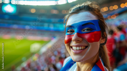Happy Russian woman supporter with face painted in Russia flag colors  white blue and red  Russian fan at a sports event such as football or rugby match  blurry stadium background  copy space