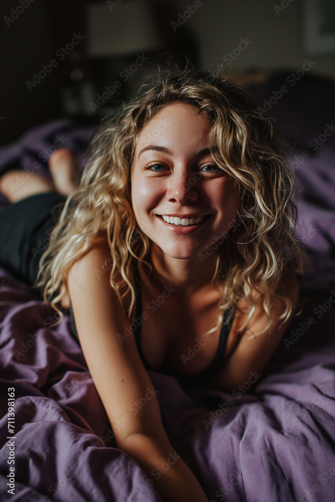 blond girl with curly hair in bed blond girl with curly hair in bed