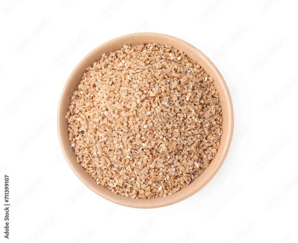 Dry wheat groats in bowl isolated on white, top view Dry wheat groats in bowl isolated on white, top view