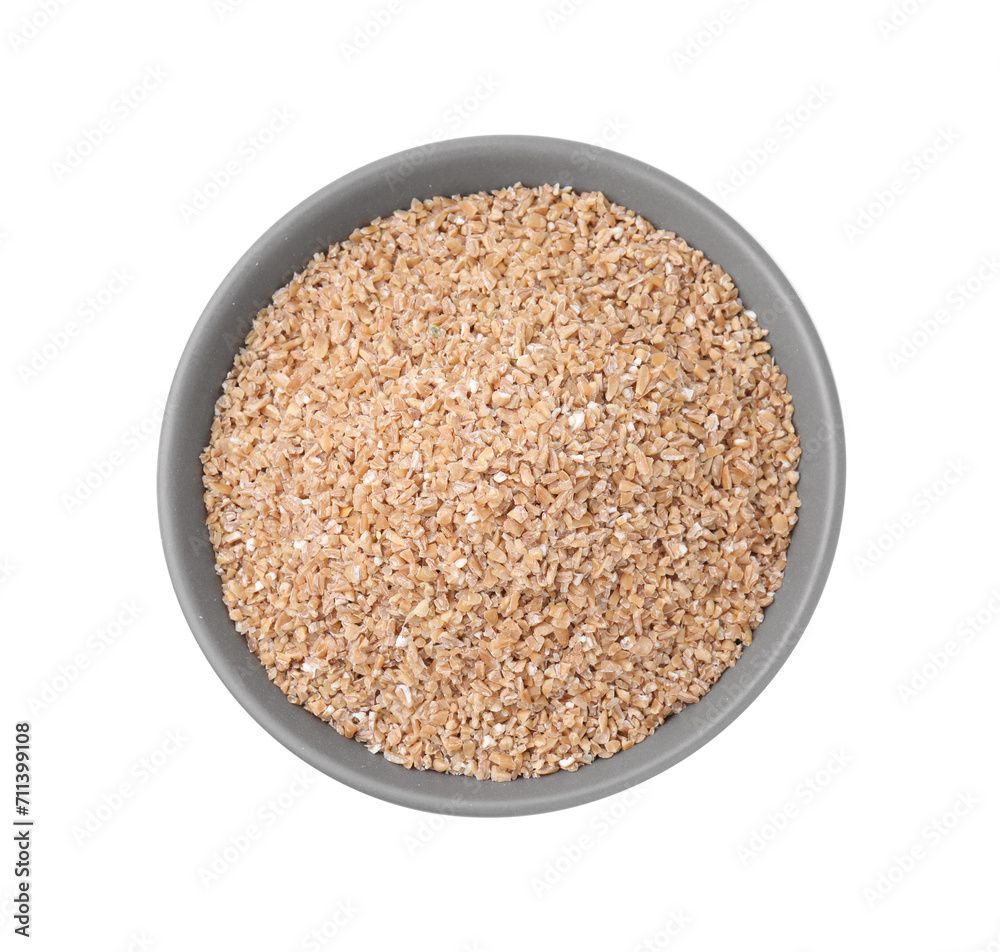 Dry wheat groats in bowl isolated on white, top view