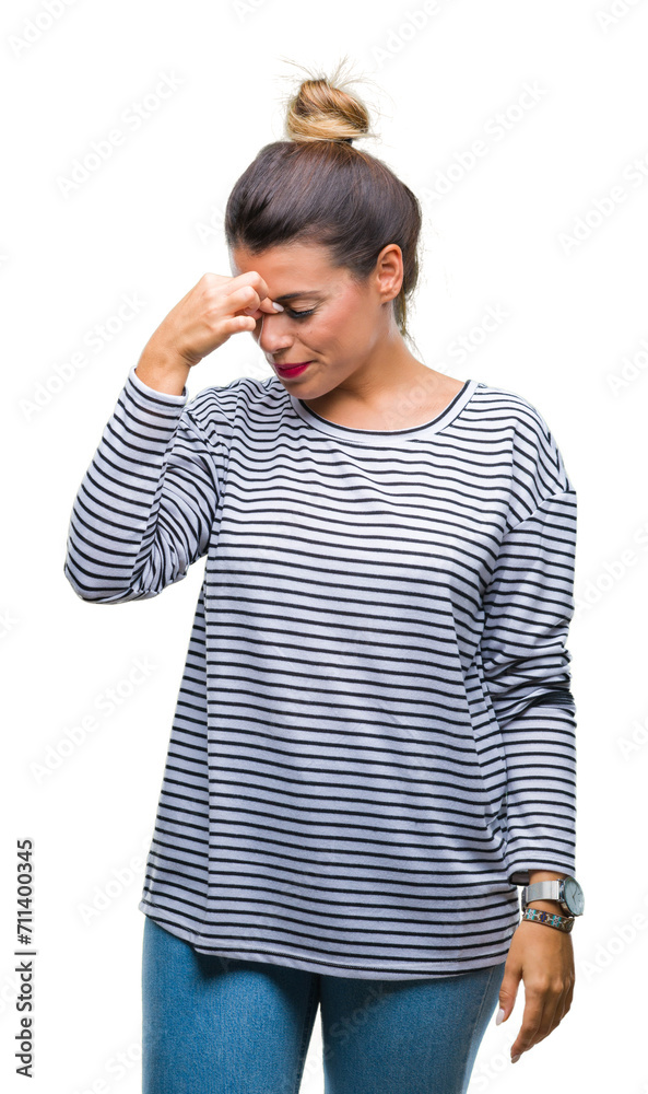 Young beautiful woman casual stripes sweater over isolated background tired rubbing nose and eyes feeling fatigue and headache. Stress and frustration concept. Young beautiful woman casual stripes sweater over isolated background tired rubbing nose and eyes feeling fatigue and headache. Stress and frustration concept.