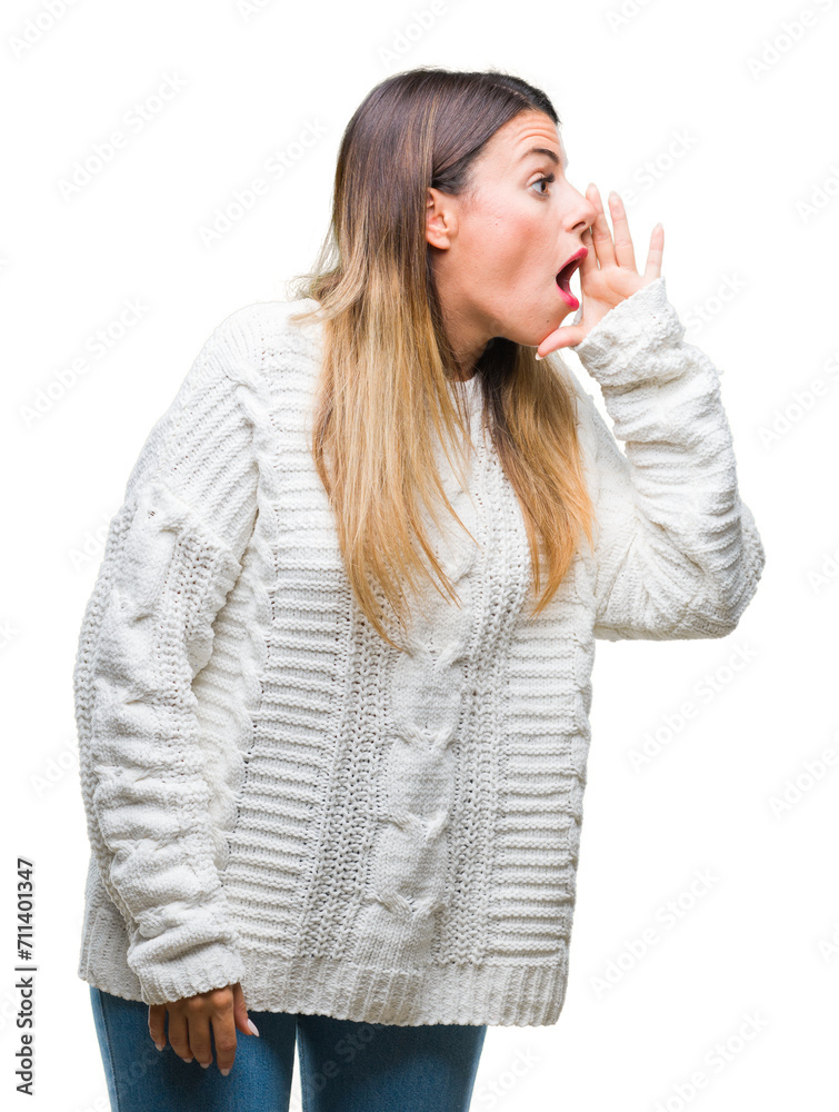 Young beautiful woman casual white sweater over isolated background shouting and screaming loud to side with hand on mouth. Communication concept. Young beautiful woman casual white sweater over isolated background shouting and screaming loud to side with hand on mouth. Communication concept.